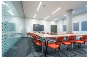 What is the role of lighting in conference room AV design